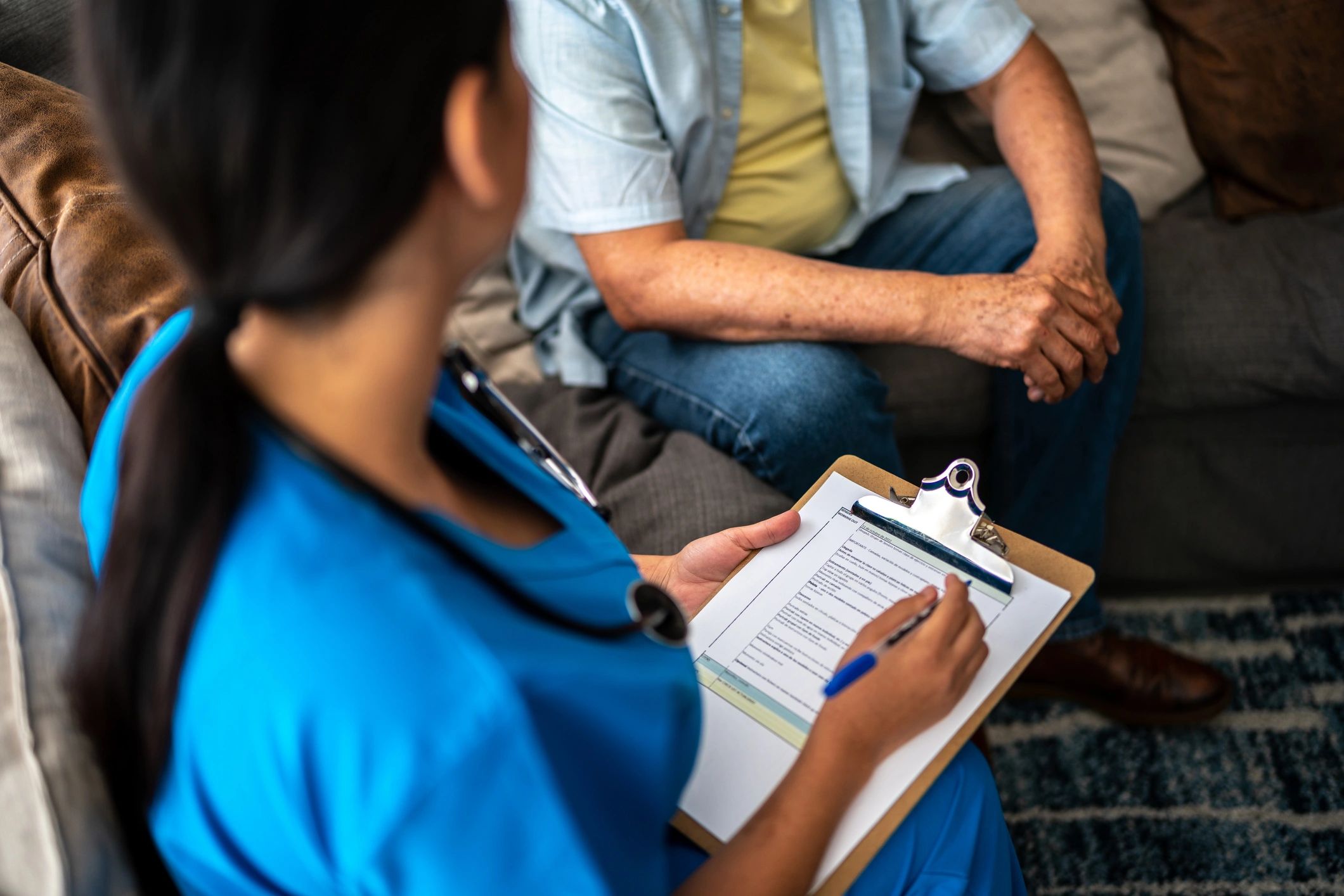 Caregiver supporting an older adult at home