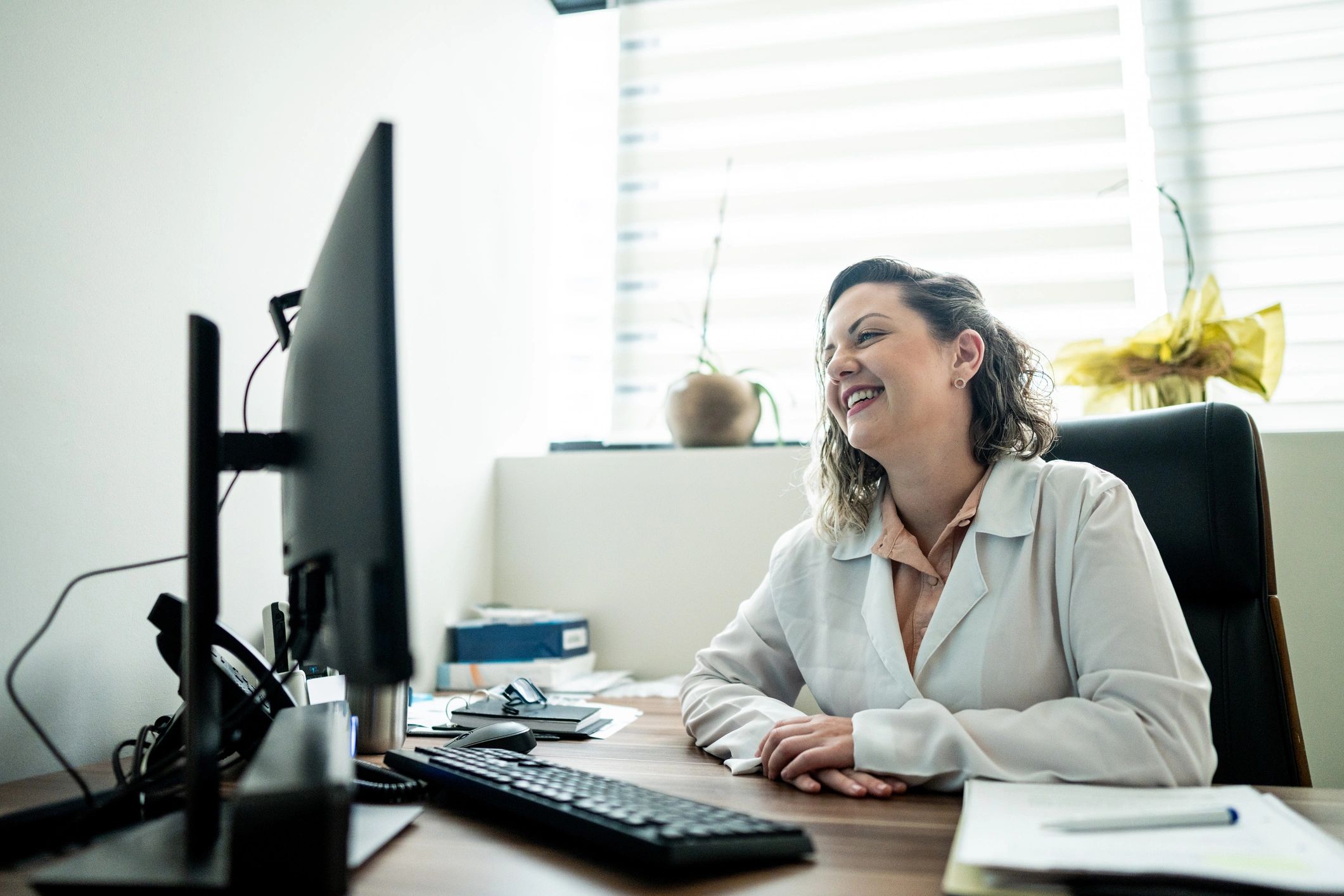 Telehealth visit with a clinician on a computer