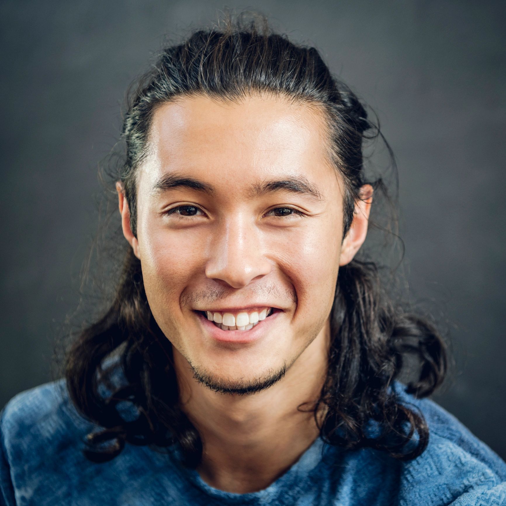 Professional headshot of a man smiling